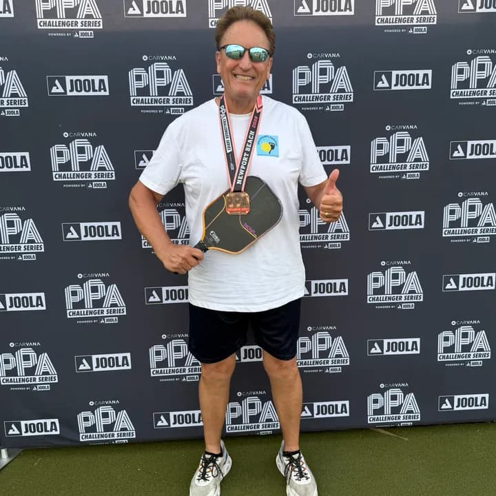 John Gill on the PPA Challenger Series podium with his medal and paddle